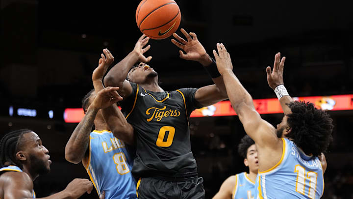 Dec 14, 2024; Columbia, Missouri, USA; Missouri Tigers guard Anthony Robinson II (0) shoots and is fouled by LIU Sharks Jason Stelle (8) during the first half at Mizzou Arena. Mandatory Credit: Denny Medley-Imagn Images Dec 14, 2024; Columbia, Missouri, USA; Missouri Tigers guard Anthony Robinson II (0) shoots and is fouled by LIU Sharks Jason Stelle (8) during the first half at Mizzou Arena. Mandatory Credit: Denny Medley-Imagn Images
