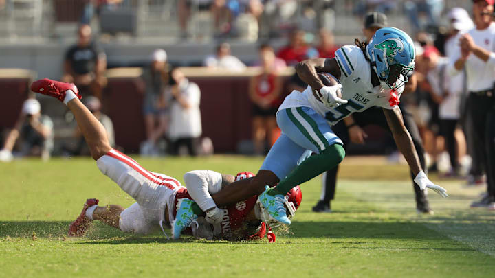 Sep 14, 2024; Norman, Oklahoma, USA;  Tulane Green Wave wide receiver Yulkeith Brown (5) catches a pass as Oklahoma Sooners defensive back Billy Bowman Jr. (2) defends during the second half at Gaylord Family-Oklahoma Memorial Stadium. 
