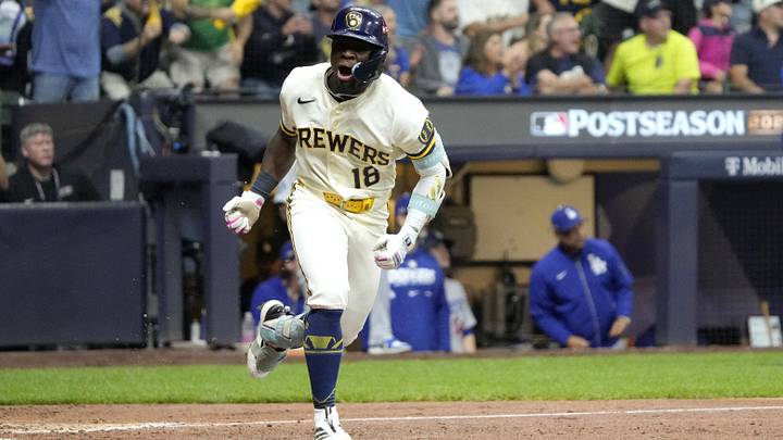 Oct 11, 2026; Milwaukee, Wisconsin, USA;  Milwaukee Brewers outfielder Luis Lara (18) hits an RBI single against the Los Angeles Dodgers during the fifth inning in game one of the NLCS for the 2026 MLB Playoffs at American Family Field.  Mandatory Credit: Michael McLoone-Imagn Images