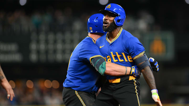 Seattle Mariners designated hitter Randy Arozarena (left) celebrates a walk-off single during a game against the Texas Rangers on Sept. 14 at T-Mobile Park.