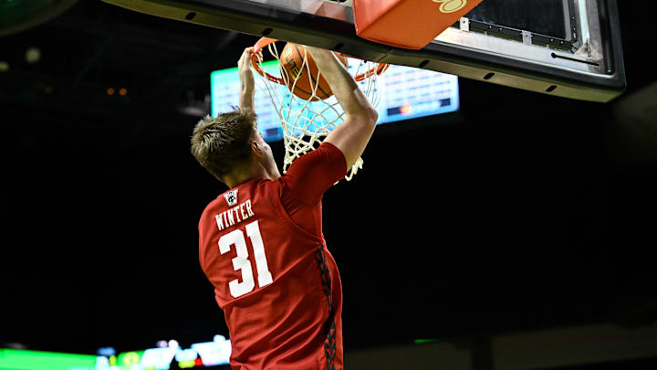 Feb 25, 2026; Eugene, Oregon, USA; Wisconsin Badgers forward Nolan Winter (31) dunks the ball during the second half against the Oregon Ducks at Matthew Knight Arena. Mandatory Credit: Craig Strobeck-Imagn Images Feb 25, 2026; Eugene, Oregon, USA; Wisconsin Badgers forward Nolan Winter (31) dunks the ball during the second half against the Oregon Ducks at Matthew Knight Arena. Mandatory Credit: Craig Strobeck-Imagn Images