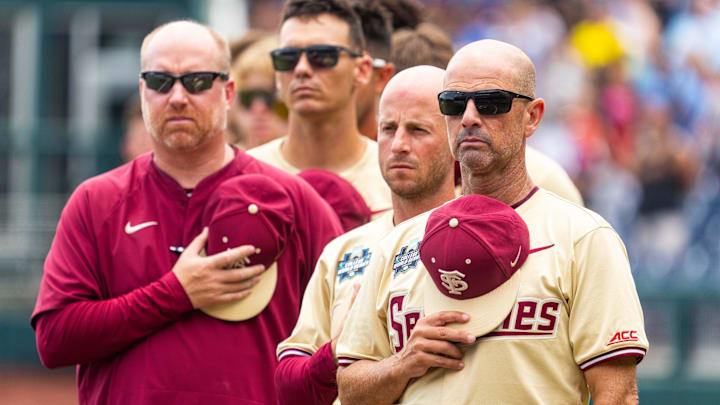Jun 18, 2024; Omaha, NE, USA; Florida State Seminoles head coach Link Jarrett during the national anthem before the game against the North Carolina Tar Heels at Charles Schwab Field Omaha. Mandatory Credit: Dylan Widger-Imagn Images
