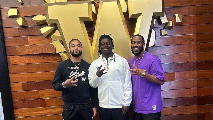 Dontay Tyson, middle, is shown on his recent UW recruiting visit with staffer Kekoa Crawford and receivers coach Kevin Cummings. 