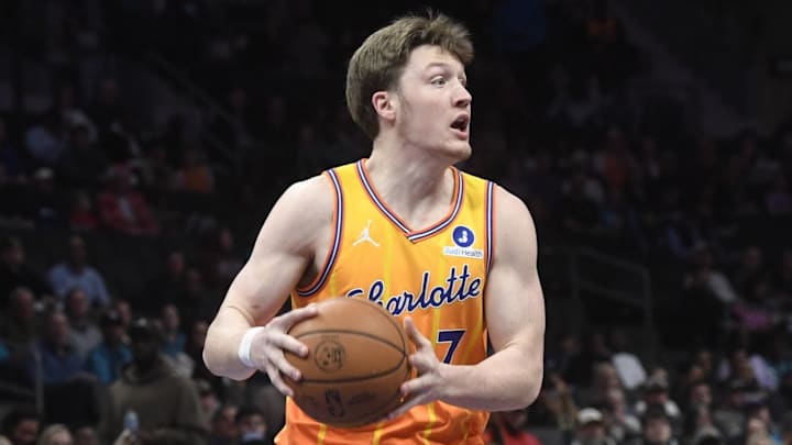 Dec 18, 2025; Charlotte, North Carolina, USA;  Charlotte Hornets forward Kon Knueppel (7) passes during the first half against the Atlanta Hawks at the Spectrum Center. Mandatory Credit: Sam Sharpe-Imagn Images