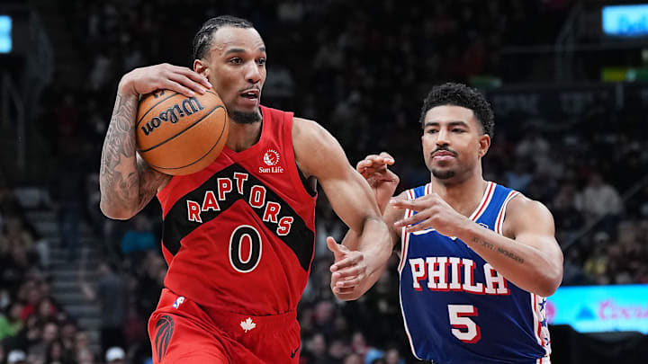 Mar 12, 2025; Toronto, Ontario, CAN; Toronto Raptors guard A.J. Lawson (0) battles for the ball with Philadelphia 76ers guard Quentin Grimes (5) during the fourth quarter at the Scotiabank Arena. Mandatory Credit: Nick Turchiaro-Imagn Images