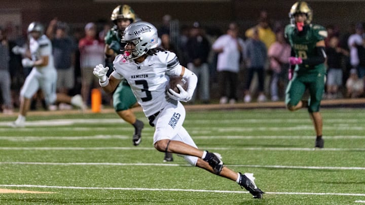 Hamilton Huskies run with the ball against the Basha Bears during a game at Basha High School in Chandler on Oct. 24, 2025.