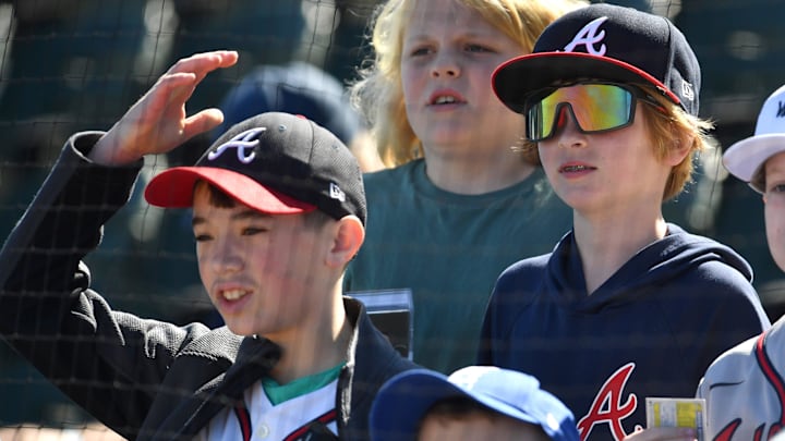Young baseball fans gather in the stands to watch Atlanta Braves players workout on Tuesday, Feb. 20, 2024, at CoolToday Park in North Port, Florida.