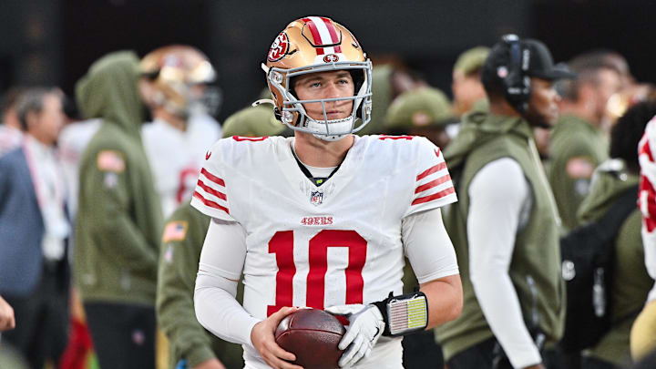 Nov 16, 2025; Glendale, Arizona, USA; San Francisco 49ers quarterback Mac Jones (10) looks on in the second half against the Arizona Cardinals at State Farm Stadium. Mandatory Credit: Matt Kartozian-Imagn Images