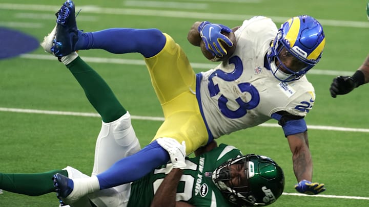Dec 20, 2020; Inglewood, California, USA; Los Angeles Rams running back Cam Akers (23) is tackled by New York Jets cornerback Javelin Guidry (40) in the fourth quarter at SoFi Stadium. The Jets defeated the Rams 23-20. Mandatory Credit: Kirby Lee-Imagn Images