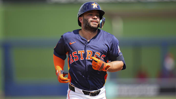 Houston Astros second base Jose Altuve (27) rounds the bases after hitting a home run.