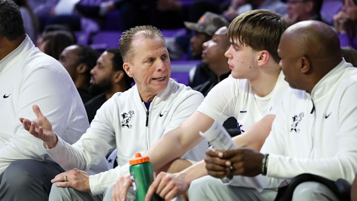 Mar 3, 2026; Manhattan, Kansas, USA; Kansas State Wildcats interim head coach Matthew Driscoll talks to forward Andrej Kostic (47) during the second half against the West Virginia Mountaineers at Bramlage Coliseum. Images