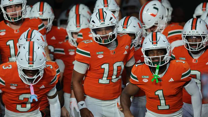 Oct 17, 2026; Miami Gardens, Florida, USA; Miami Hurricanes quarterback Darian Mensah (10), wide receiver Malachi Toney (1) and teammates take the field before a game against the Florida State Seminoles at Hard Rock Stadium. Mandatory Credit: Sam Navarro-Imagn Images Oct 17, 2026; Miami Gardens, Florida, USA; Miami Hurricanes quarterback Darian Mensah (10), wide receiver Malachi Toney (1) and teammates take the field before a game against the Florida State Seminoles at Hard Rock Stadium. Mandatory Credit: Sam Navarro-Imagn Images