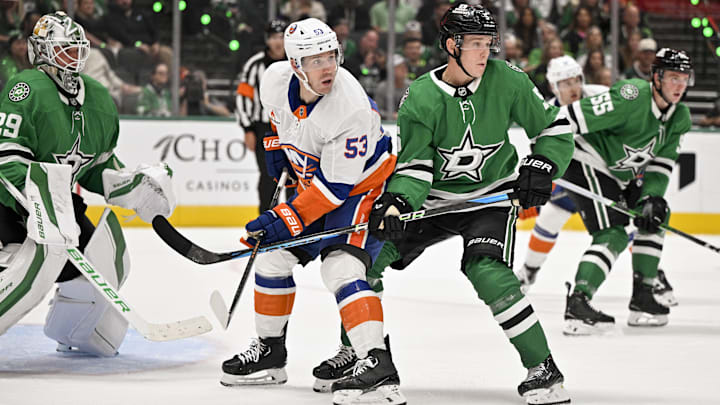 Oct 12, 2024; Dallas, Texas, USA; New York Islanders center Casey Cizikas (53) and Dallas Stars defenseman Nils Lundkvist (5) in action during the game between the Dallas Stars and the New York Islanders at the American Airlines Center. Mandatory Credit: Jerome Miron-Imagn Images