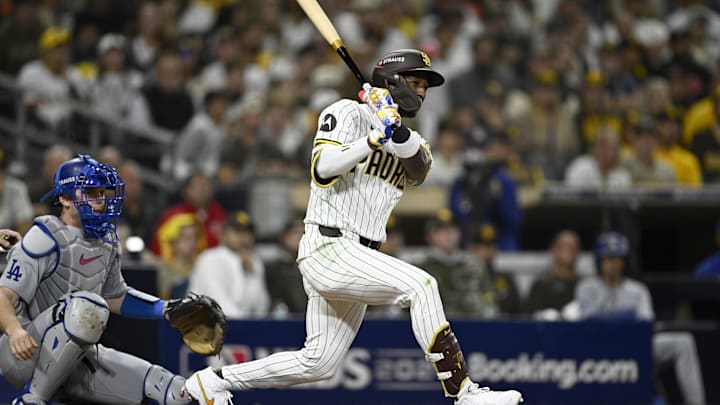 Oct 9, 2024; San Diego, California, USA; San Diego Padres outfielder Jurickson Profar (10) singles in the eighth inning against the Los Angeles Dodgers during game four of the NLDS for the 2024 MLB Playoffs at Petco Park. Mandatory Credit: Denis Poroy-Imagn Images Oct 9, 2024; San Diego, California, USA; San Diego Padres outfielder Jurickson Profar (10) singles in the eighth inning against the Los Angeles Dodgers during game four of the NLDS for the 2024 MLB Playoffs at Petco Park. Mandatory Credit: Denis Poroy-Imagn Images
