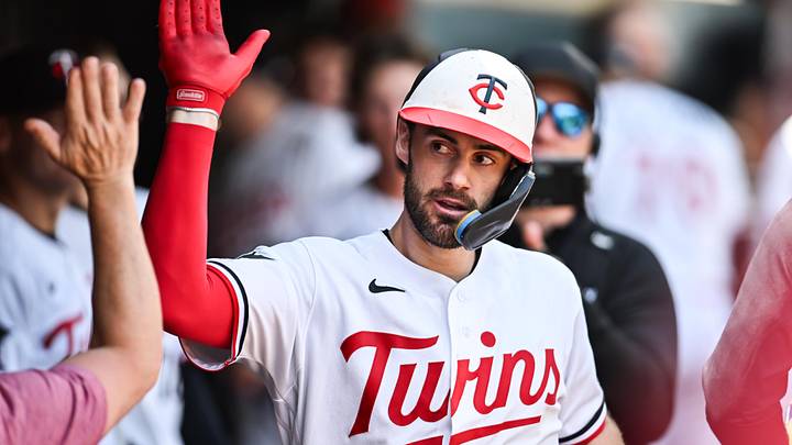 Jun 28, 2026; Minneapolis, Minnesota, USA; Minnesota Twins shortstop Ryan Kreidler (5) reacts with teammates after hitting a home run during the seventh inning against the Colorado Rockies at Target Field. 