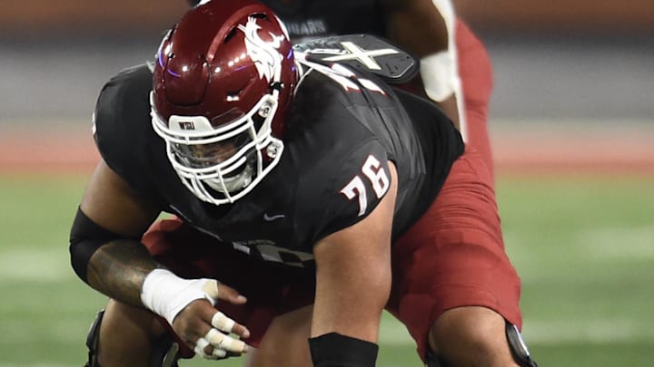 Sep 7, 2024; Pullman, Washington, USA; Washington State Cougars offensive lineman Esa Pole (76) comes set for a play against the Texas Tech Red Raiders in the second half at Gesa Field at Martin Stadium. Washington State Cougars won 37-16. Mandatory Credit: James Snook-Imagn Images Sep 7, 2024; Pullman, Washington, USA; Washington State Cougars offensive lineman Esa Pole (76) comes set for a play against the Texas Tech Red Raiders in the second half at Gesa Field at Martin Stadium. Washington State Cougars won 37-16. Mandatory Credit: James Snook-Imagn Images