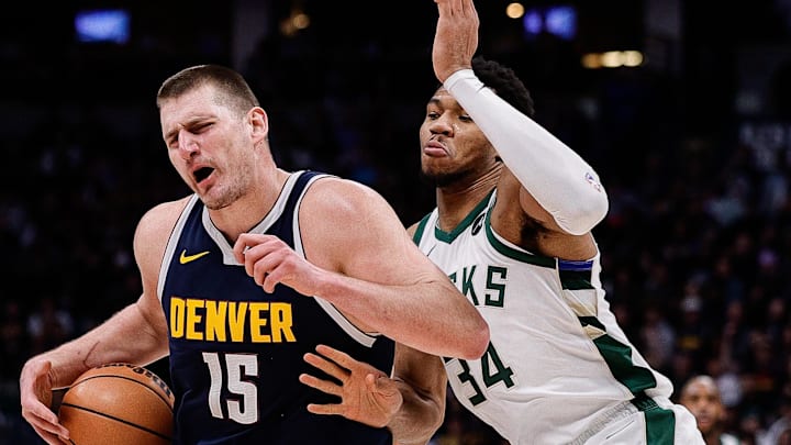 Jan 29, 2024; Denver, Colorado, USA; Denver Nuggets center Nikola Jokic (15) controls the ball against Milwaukee Bucks forward Giannis Antetokounmpo (34) in the third quarter at Ball Arena. Mandatory Credit: Isaiah J. Downing-Imagn Images