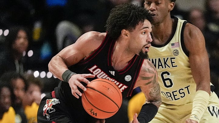 Feb 7, 2026; Winston-Salem, North Carolina, USA; Louisville Cardinals guard J'vonne Hadley (1) handles the ball against Wake Forest Demon Deacons guard Myles Colvin (6) during the first half at Lawrence Joel Veterans Memorial Coliseum. Mandatory Credit: Jim Dedmon-Imagn Images