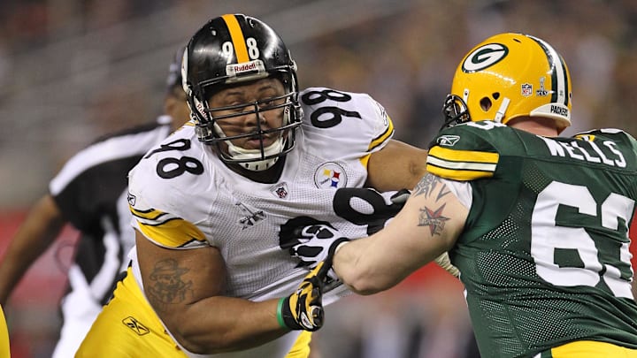 Feb 6, 2011; Arlington, TX, USA; Pittsburgh Steelers nose tackle Casey Hampton (98) in action against Green Bay Packers center Scott Wells (63) during the first half of Super Bowl XLV at Cowboys Stadium. Mandatory Credit: Matthew Emmons-Imagn Images Feb 6, 2011; Arlington, TX, USA; Pittsburgh Steelers nose tackle Casey Hampton (98) in action against Green Bay Packers center Scott Wells (63) during the first half of Super Bowl XLV at Cowboys Stadium. Mandatory Credit: Matthew Emmons-Imagn Images