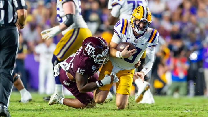 LSU quarterback Garrett Nussmeier scrambles and is sacked by Texas A&M defensive end Rylan Kennedy as the LSU Tigers take on the Texas A&M Aggies on Oct. 25, 2025, at Tiger Stadium in Baton Rouge, La. LSU quarterback Garrett Nussmeier scrambles and is sacked by Texas A&M defensive end Rylan Kennedy as the LSU Tigers take on the Texas A&M Aggies on Oct. 25, 2025, at Tiger Stadium in Baton Rouge, La.
