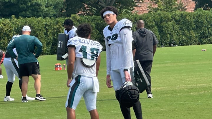 Johnny Wilson chats with fellow WR Avery Williams after a joint practice with the Cleveland Browns on Aug. 14, 2025.
