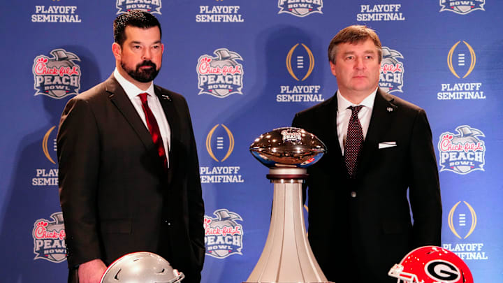 Dec 30, 2022; Atlanta, GA, USA; Ohio State Buckeyes head coach Ryan Day and Georgia Bulldogs head coach Kirby Smart pose for a photo during the coaches Peach Bowl press conference at the Westin Peachtree Plaza. Dec 30, 2022; Atlanta, GA, USA; Ohio State Buckeyes head coach Ryan Day and Georgia Bulldogs head coach Kirby Smart pose for a photo during the coaches Peach Bowl press conference at the Westin Peachtree Plaza.