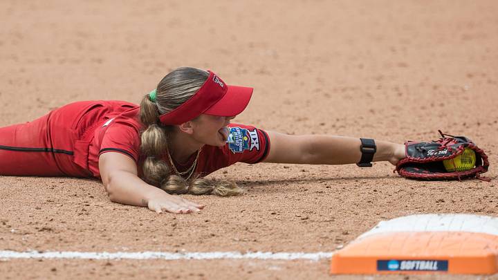 May 30, 2026; Oklahoma City, OK, USA;  Texas Tech Red Raiders infielder Jackie Lis (00) reacts after making a catch while colliding with the Tennessee Lady Volunteers infielder Emma Clarke (not pictured) in the third inning during the NCAA Women’s College World Series at Devon Park. Mandatory Credit: Brett Rojo-Imagn Images