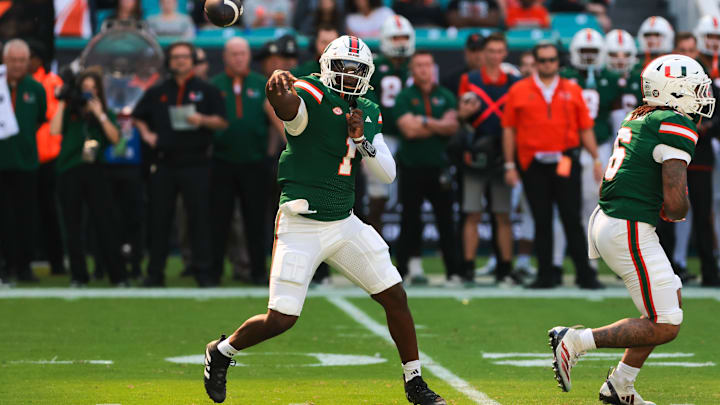 Nov 23, 2024; Miami Gardens, Florida, USA; Miami Hurricanes quarterback Cam Ward (1) throws the football against the Wake Forest Demon Deacons during the first quarter at Hard Rock Stadium.  