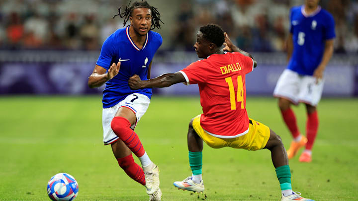 FBL-OLY-PARIS-2024-FRA-GUI - Olise takes on his man in win over Guinea