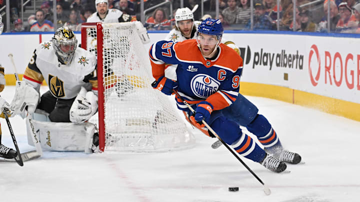 Dec 21, 2025; Edmonton, Alberta, CAN; Edmonton Oilers center Connor McDavid (97) with Vegas Golden Knights goalie Carter Hart (79) are seen out on the ice during the first period at Rogers Place. Mandatory Credit: Walter Tychnowicz-Imagn Images