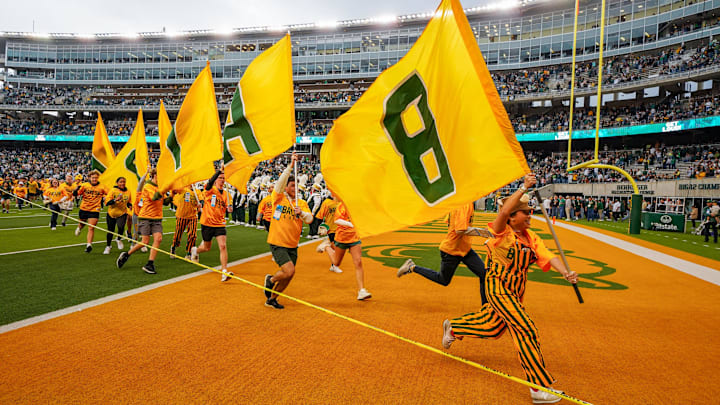 Nov 1, 2025; Waco, Texas, USA; The Baylor flags run the field prior to a game between the Baylor Bears and the UCF Knights at McLane Stadium. Mandatory Credit: Raymond Carlin III-Imagn Images Nov 1, 2025; Waco, Texas, USA; The Baylor flags run the field prior to a game between the Baylor Bears and the UCF Knights at McLane Stadium. Mandatory Credit: Raymond Carlin III-Imagn Images