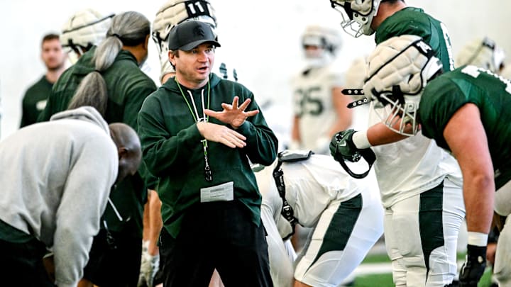 Michigan State's head coach Jonathan Smith, left, talks with Justin Bell during football practice on Tuesday, April 8, 2025, in East Lansing.