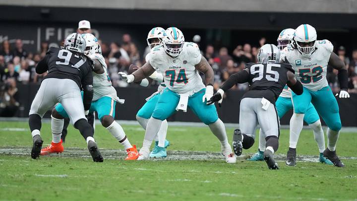 Miami Dolphins offensive lineman Kadyn Proctor (74) and offensive tackle Patrick Paul (52) defend against Las Vegas Raiders defensive tackle Tonka Hemingway (97) and defensive end Kwity Paye (95) at Allegiant Stadium.