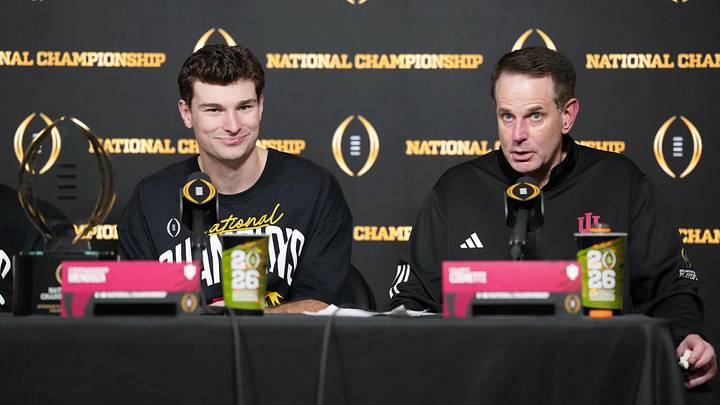 Jan 19, 2026; Miami Gardens, FL, USA; Indiana Hoosiers quarterback Fernando Mendoza (left) and head coach Curt Cignetti at press conference after the CFP National Championship college football game against the Miami Hurricanes at Hard Rock Stadium. Mandatory Credit: Kirby Lee-Imagn Images Jan 19, 2026; Miami Gardens, FL, USA; Indiana Hoosiers quarterback Fernando Mendoza (left) and head coach Curt Cignetti at press conference after the CFP National Championship college football game against the Miami Hurricanes at Hard Rock Stadium. Mandatory Credit: Kirby Lee-Imagn Images