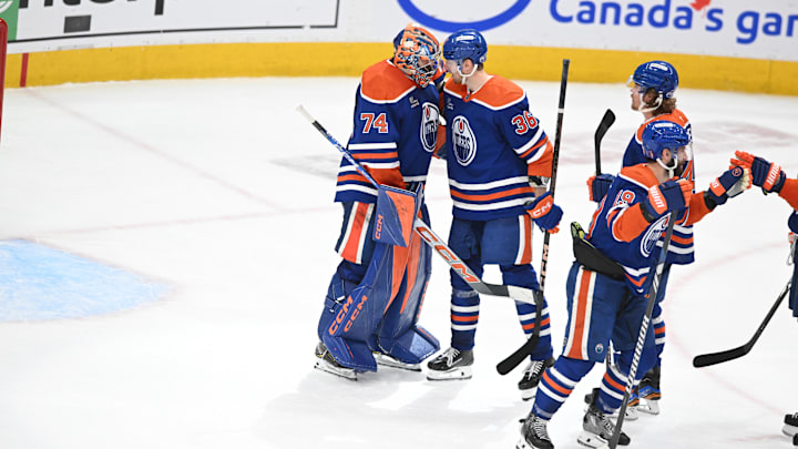 May 12, 2025; Edmonton, Alberta, CAN; Edmonton Oilers goalie Stuart Skinner (74) celebrates their win with defenseman John Klingberg (36) over the Las Vegas Golden Knights during the third period in game three of the second round of the 2025 Stanley Cup Playoffs at Rogers Place. Mandatory Credit: Walter Tychnowicz-Imagn Images