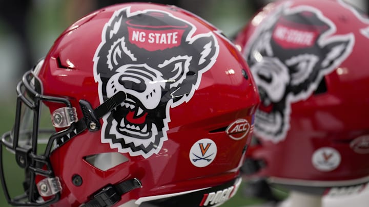 Dec 30, 2022; Charlotte, NC, USA; North Carolina State Wolfpack helmets during the first half against the Maryland Terrapins in the 2022 Duke's Mayo Bowl at Bank of America Stadium. Mandatory Credit: Jim Dedmon-Imagn Images Dec 30, 2022; Charlotte, NC, USA; North Carolina State Wolfpack helmets during the first half against the Maryland Terrapins in the 2022 Duke's Mayo Bowl at Bank of America Stadium. Mandatory Credit: Jim Dedmon-Imagn Images