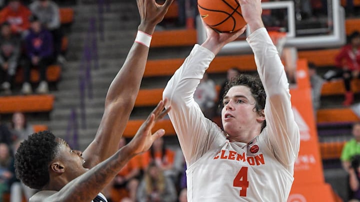 Clemson senior forward Ian Schieffelin (4) makes a three-point shot near Radford forward TJ NeSmith (13) during the second half at Littlejohn Coliseum Thursday, November 21, 2024; Clemson, SC, USA. Clemson senior forward Ian Schieffelin (4) makes a three-point shot near Radford forward TJ NeSmith (13) during the second half at Littlejohn Coliseum Thursday, November 21, 2024; Clemson, SC, USA.