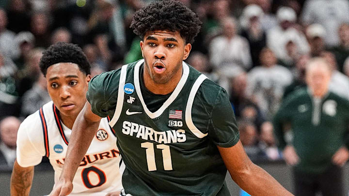 Michigan State guard Jase Richardson drives to the basket against Auburn guard Tahaad Pettiford during the first half of the Elite Eight round of the NCAA tournament at State Farm Arena in Atlanta on Sunday, March 30, 2025.