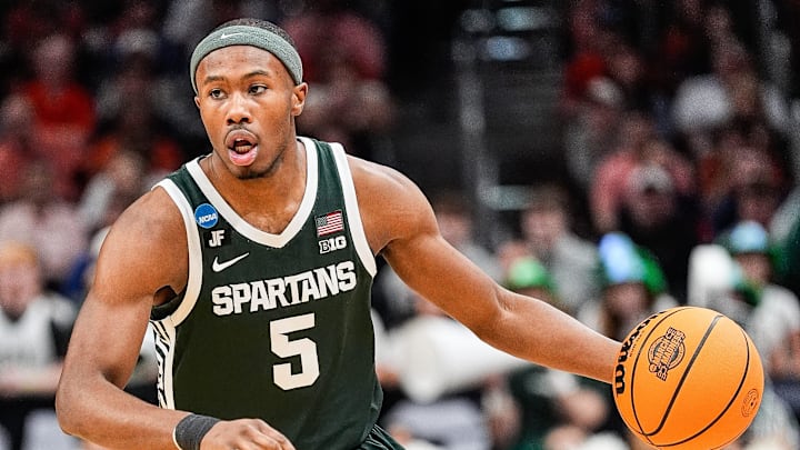 Michigan State guard Tre Holloman (5) looks to pass against Auburn during the first half of the Elite Eight round of the NCAA tournament at State Farm Arena in Atlanta, Ga. on Sunday, March 30, 2025. Michigan State guard Tre Holloman (5) looks to pass against Auburn during the first half of the Elite Eight round of the NCAA tournament at State Farm Arena in Atlanta, Ga. on Sunday, March 30, 2025.