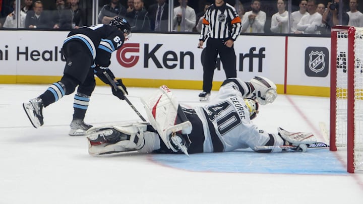 Sep 23, 2024; Salt Lake City, Utah, USA; Los Angeles Kings goaltender Carter George} (40) blocks the shot of Utah Hockey Club forward Matias Maccelli (63) during a shootout at Delta Center. Mandatory Credit: Rob Gray-Imagn Images