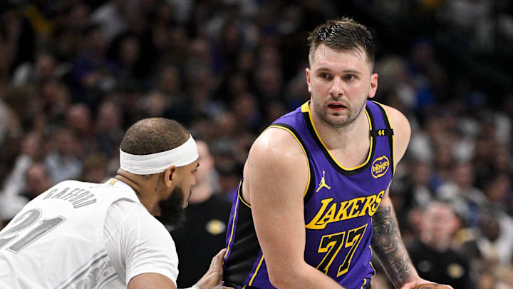 Apr 9, 2025; Dallas, Texas, USA; Dallas Mavericks center Daniel Gafford (21) and Los Angeles Lakers guard Luka Doncic (77) in action during the game between the Dallas Mavericks and the Los Angeles Lakers at American Airlines Center. Mandatory Credit: Jerome Miron-Imagn Images