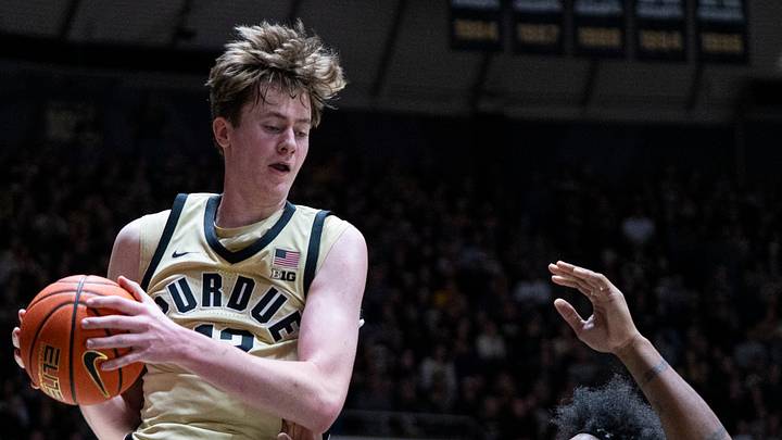 Dec 29, 2025; West Lafayette, Indiana, USA; Purdue Boilermakers center Daniel Jacobsen (12) grabs a rebound over Kent State Golden Flashes forward Rob Whaley Jr. (2) during the second half at Mackey Arena. Mandatory Credit: Jacob Musselman-Imagn Images Dec 29, 2025; West Lafayette, Indiana, USA; Purdue Boilermakers center Daniel Jacobsen (12) grabs a rebound over Kent State Golden Flashes forward Rob Whaley Jr. (2) during the second half at Mackey Arena. Mandatory Credit: Jacob Musselman-Imagn Images