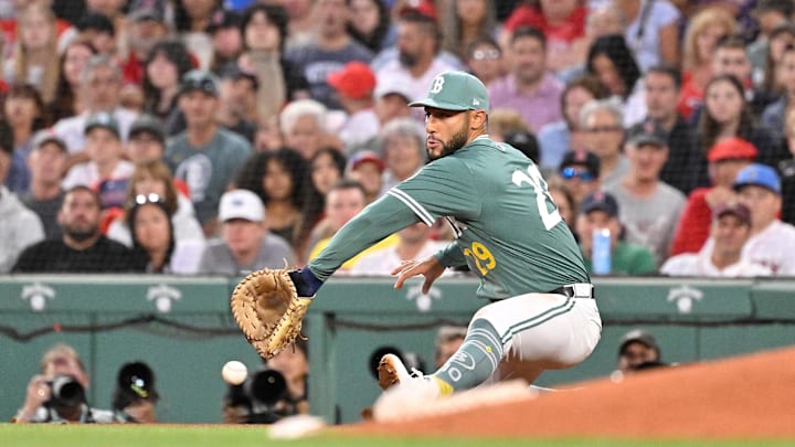 Aug 1, 2025; Boston, Massachusetts, USA; Boston Red Sox first baseman Abraham Toro (29) can't make the catch at first base during the fifth inning against the Houston Astros at Fenway Park. Mandatory Credit: Eric Canha-Imagn Images
