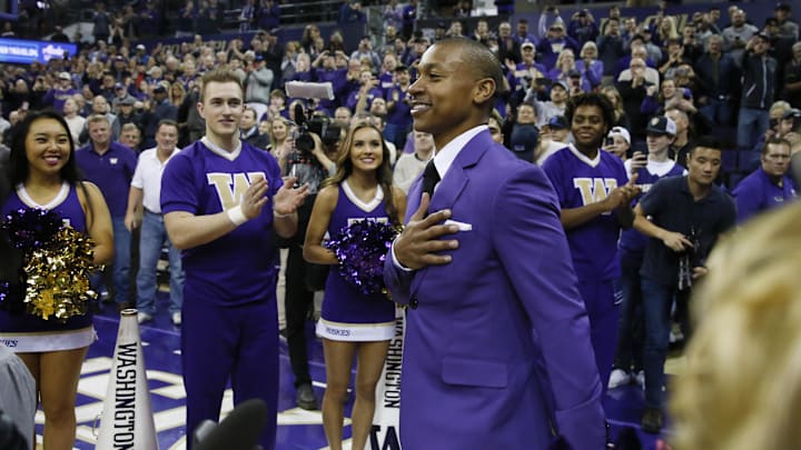 Isaiah Thomas walks onto the court in 2018 to have his jersey retired.