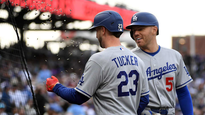 Dodgers outfielder Kyle Tucker (23) celebrates with  infielder Freddie Freeman (5) and teammates after a home run during the first inning against the Colorado Rockies at Coors Field on April 18.