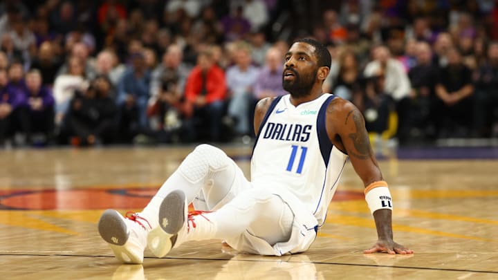 Dallas Mavericks guard Kyrie Irving (11) reacts against the Phoenix Suns at Footprint Center. Mandatory Credit: Mark J. Rebilas-Imagn Images