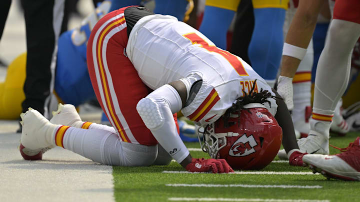 Sep 29, 2024; Inglewood, California, USA; Kansas City Chiefs wide receiver Rashee Rice (4) pounds his fist on the ground after an injury in the first half against the Los Angeles Chargers at SoFi Stadium. Mandatory Credit: Jayne Kamin-Oncea-Imagn Images Sep 29, 2024; Inglewood, California, USA; Kansas City Chiefs wide receiver Rashee Rice (4) pounds his fist on the ground after an injury in the first half against the Los Angeles Chargers at SoFi Stadium. Mandatory Credit: Jayne Kamin-Oncea-Imagn Images