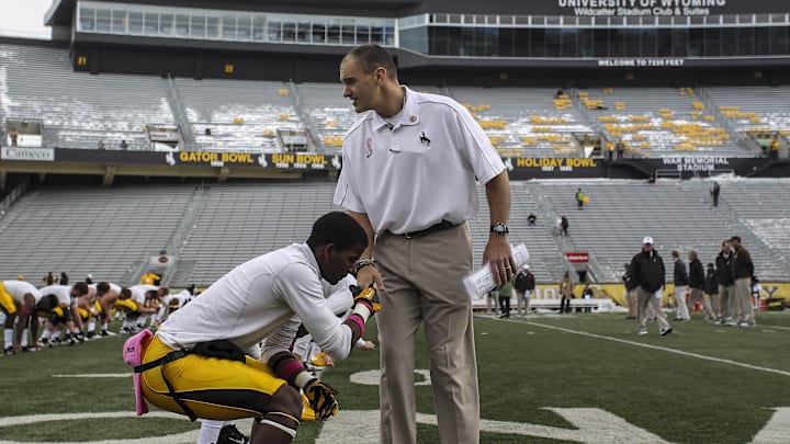 In 2012, former Husky offensive guard Pete Kaligis was Wyoming's interim coach, a role he'll handle for WSU into the Holiday Bowl. In 2012, former Husky offensive guard Pete Kaligis was Wyoming's interim coach, a role he'll handle for WSU into the Holiday Bowl.
