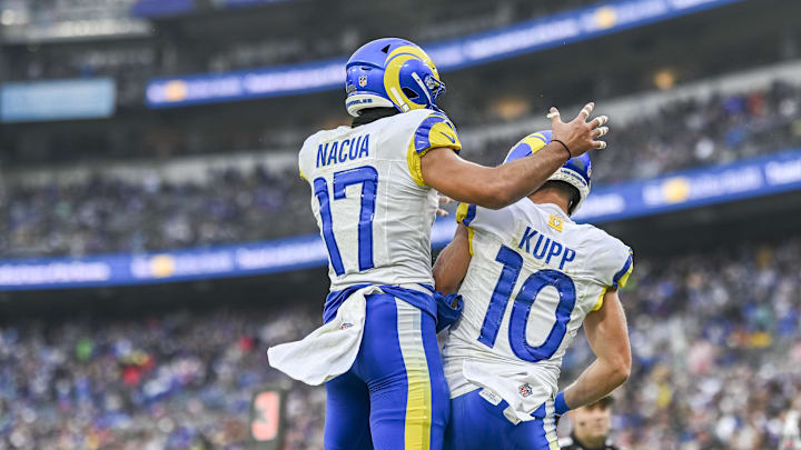Dec 10, 2023; Baltimore, Maryland, USA;  Los Angeles Rams wide receiver Cooper Kupp (10) celebrates with wide receiver Puka Nacua (17) after scoring a second quarter touchdown  during the  at M&T Bank Stadium. Mandatory Credit: Tommy Gilligan-Imagn Images
