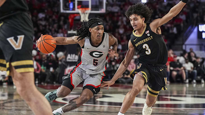 Mar 8, 2025; Athens, Georgia, USA; Georgia Bulldogs guard Silas Demary Jr. (5) dribbles against Vanderbilt Commodores guard Tyler Tanner (3) during the first half at Stegeman Coliseum. Mandatory Credit: Dale Zanine-Imagn Images